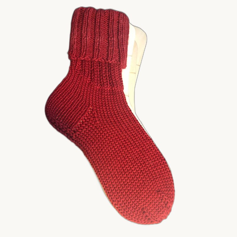 Rote handgestrickte Socke
